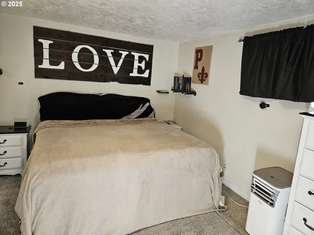 a view of room with flat screen tv