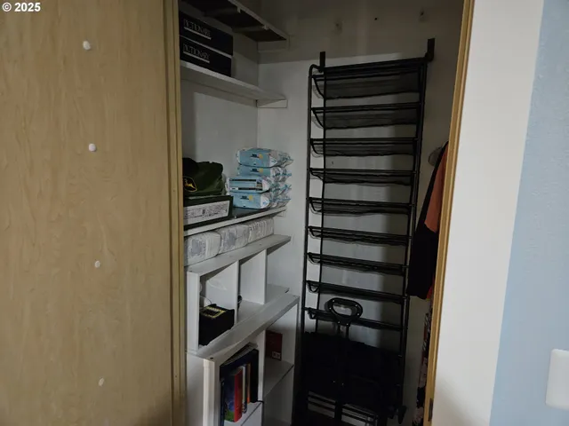 a living room with furniture and a mirror