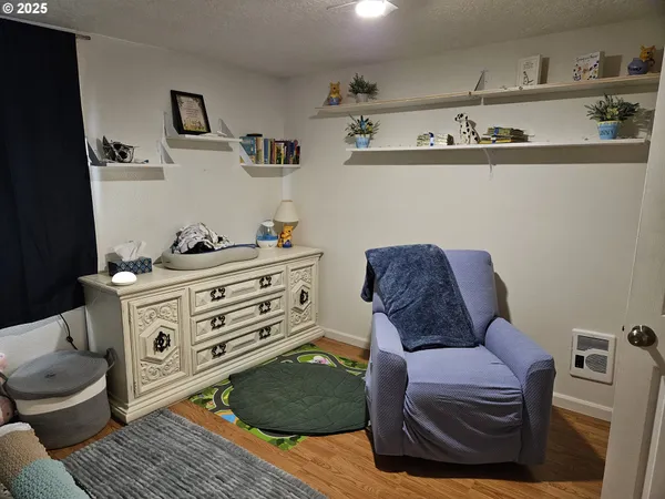 a room with cabinets and chair