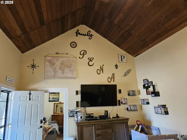 a room with furniture and flat screen tv