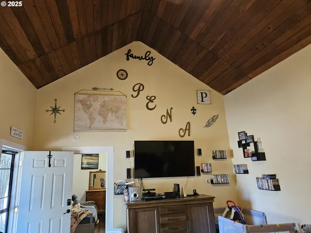 a room with furniture and flat screen tv