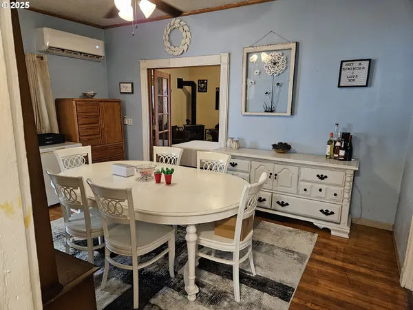 a dining room with furniture and window