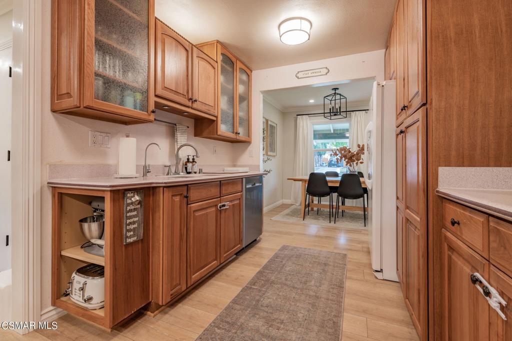 75 Neish Street Camarillo, CA 93010 - Photo 4 of 42 a kitchen with stainless steel appliances granite countertop a sink and cabinets