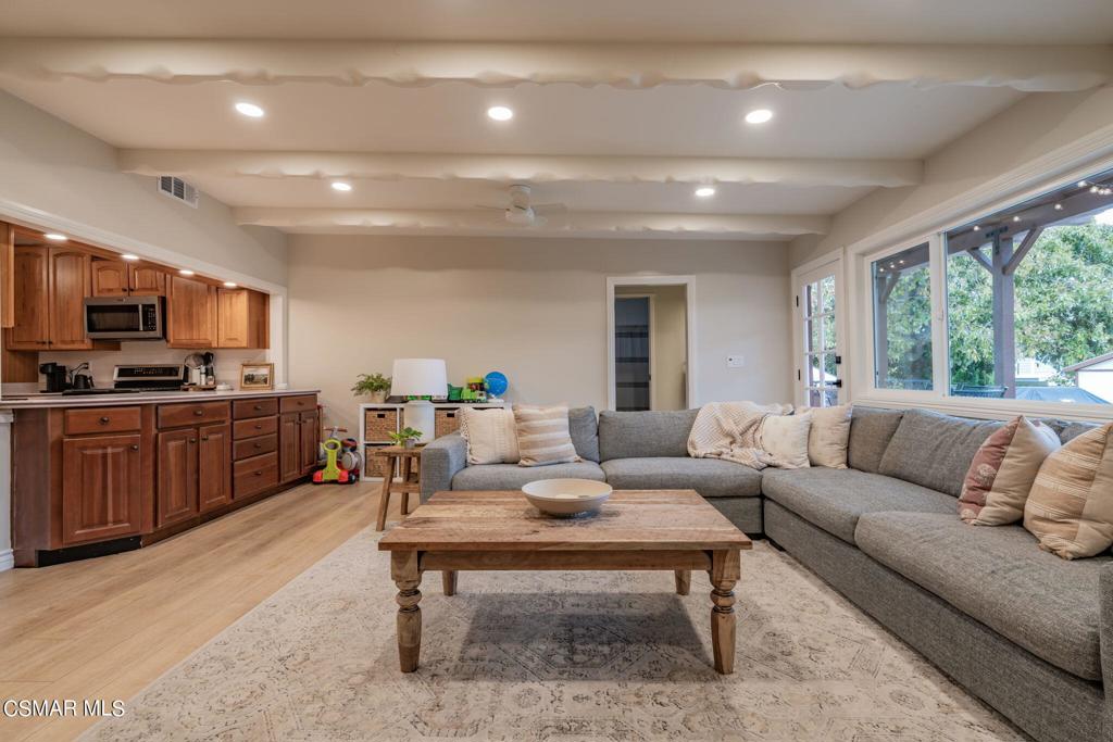 75 Neish Street Camarillo, CA 93010 - Photo 5 of 42 a living room with furniture fireplace and a large window