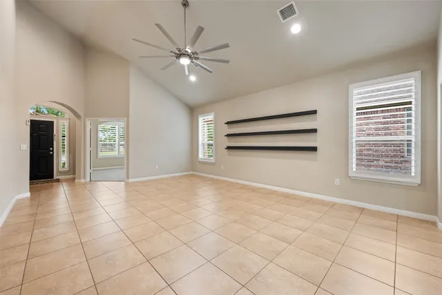 a view of an empty room with a window