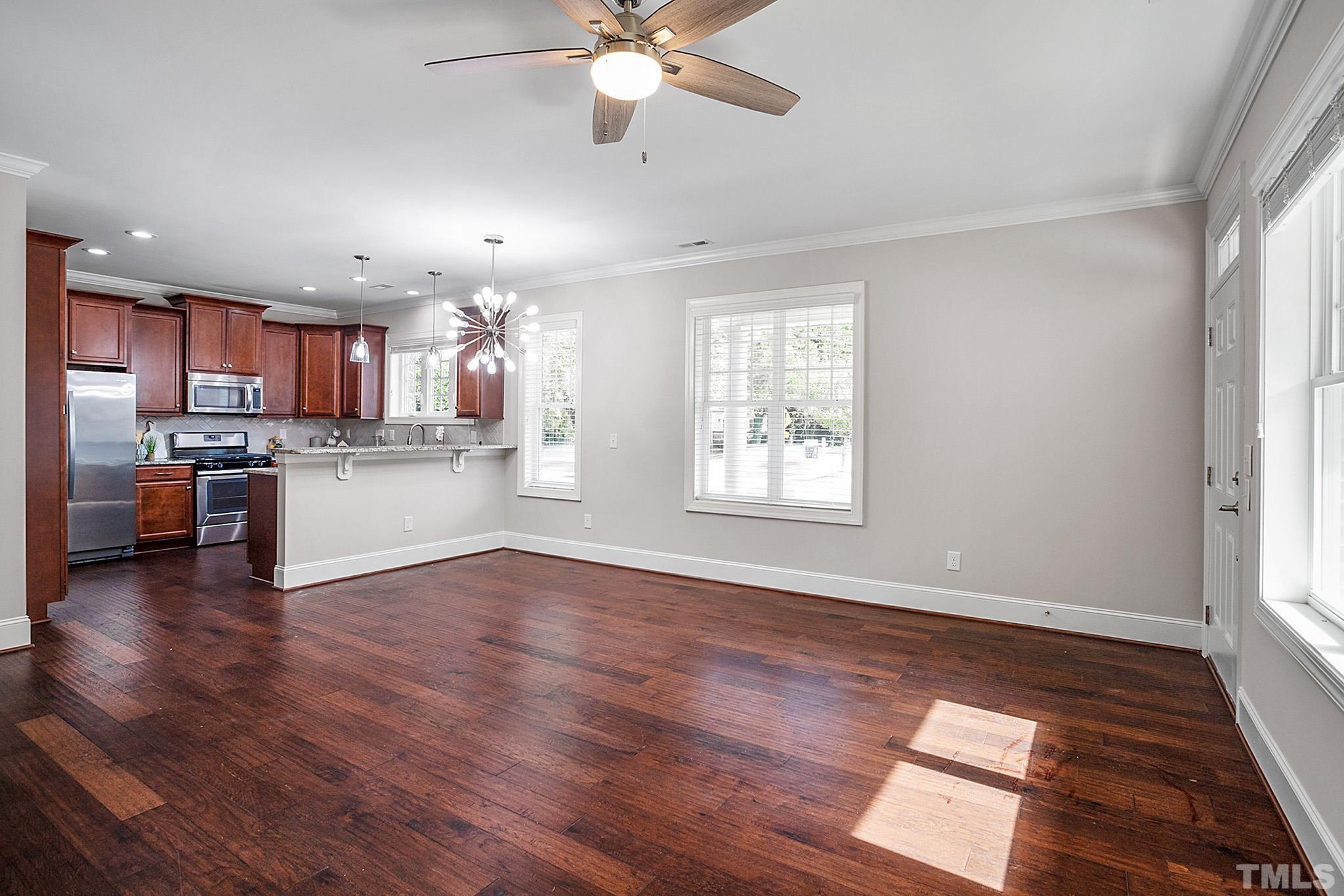 2820 Plumfield Place Raleigh, NC 27607 - Photo 12 of 23 a view of kitchen with wooden floor and a window