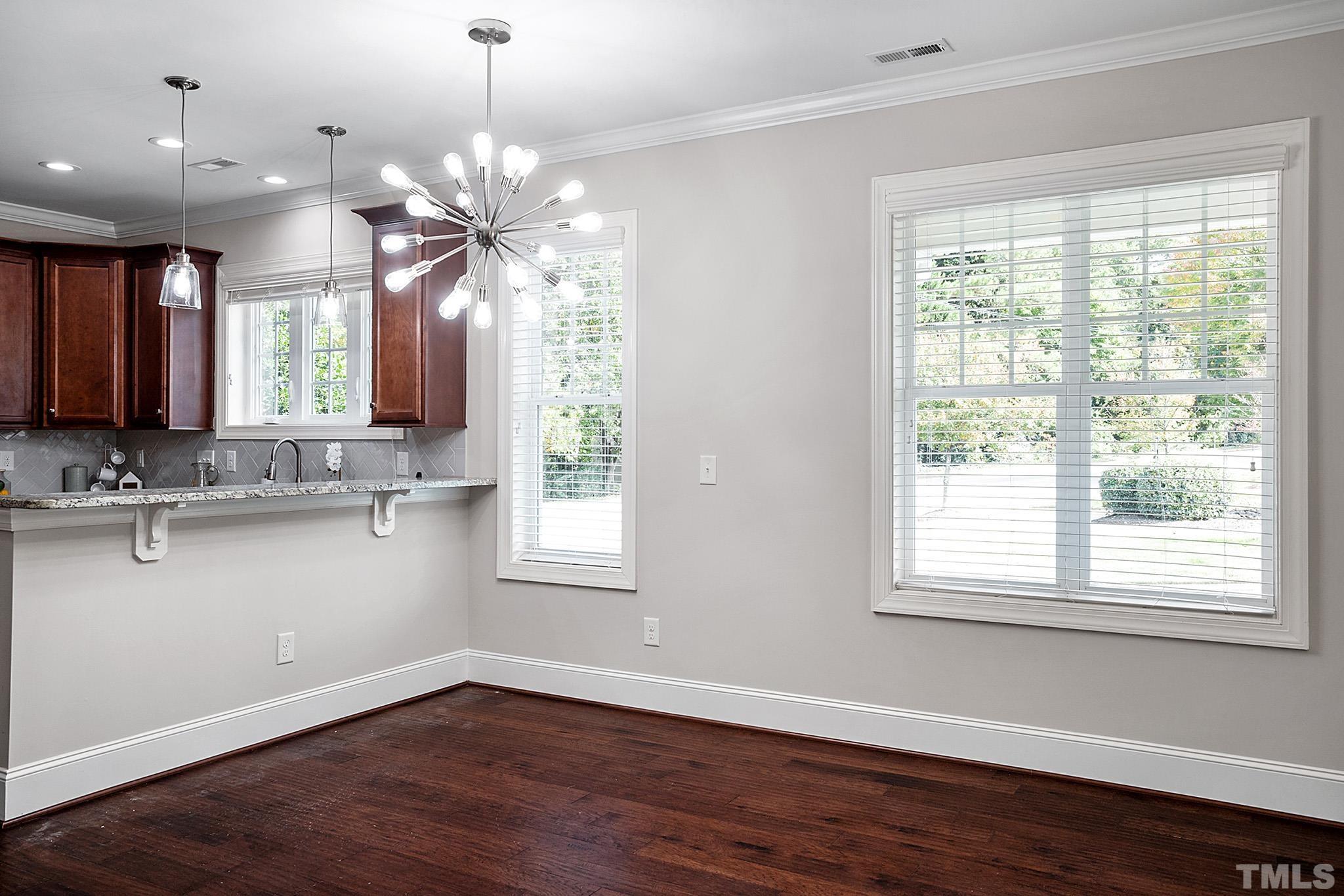 2820 Plumfield Place Raleigh, NC 27607 - Photo 13 of 23 a view of a kitchen with granite countertop a large window