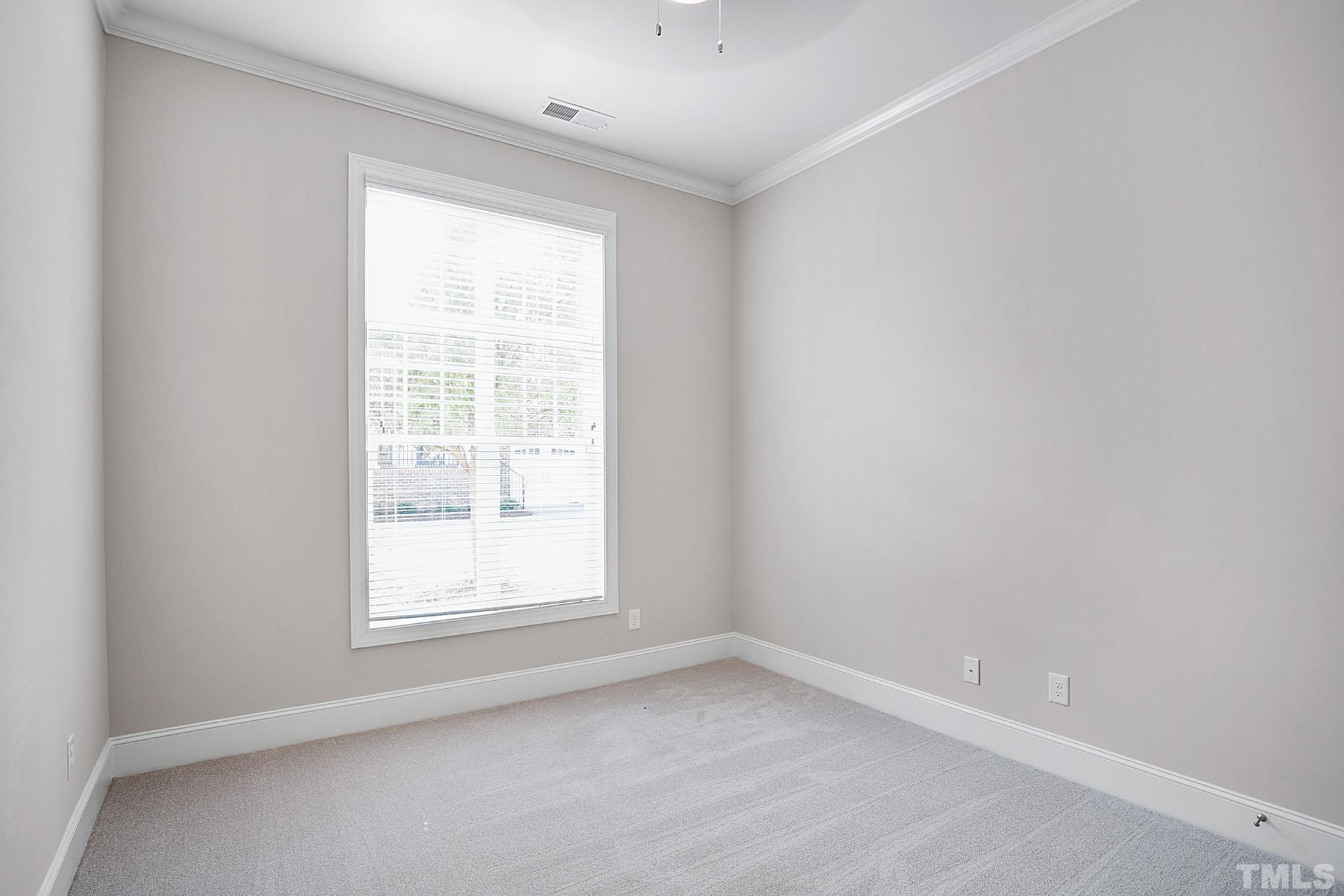 2820 Plumfield Place Raleigh, NC 27607 - Photo 14 of 23 an empty room with a window