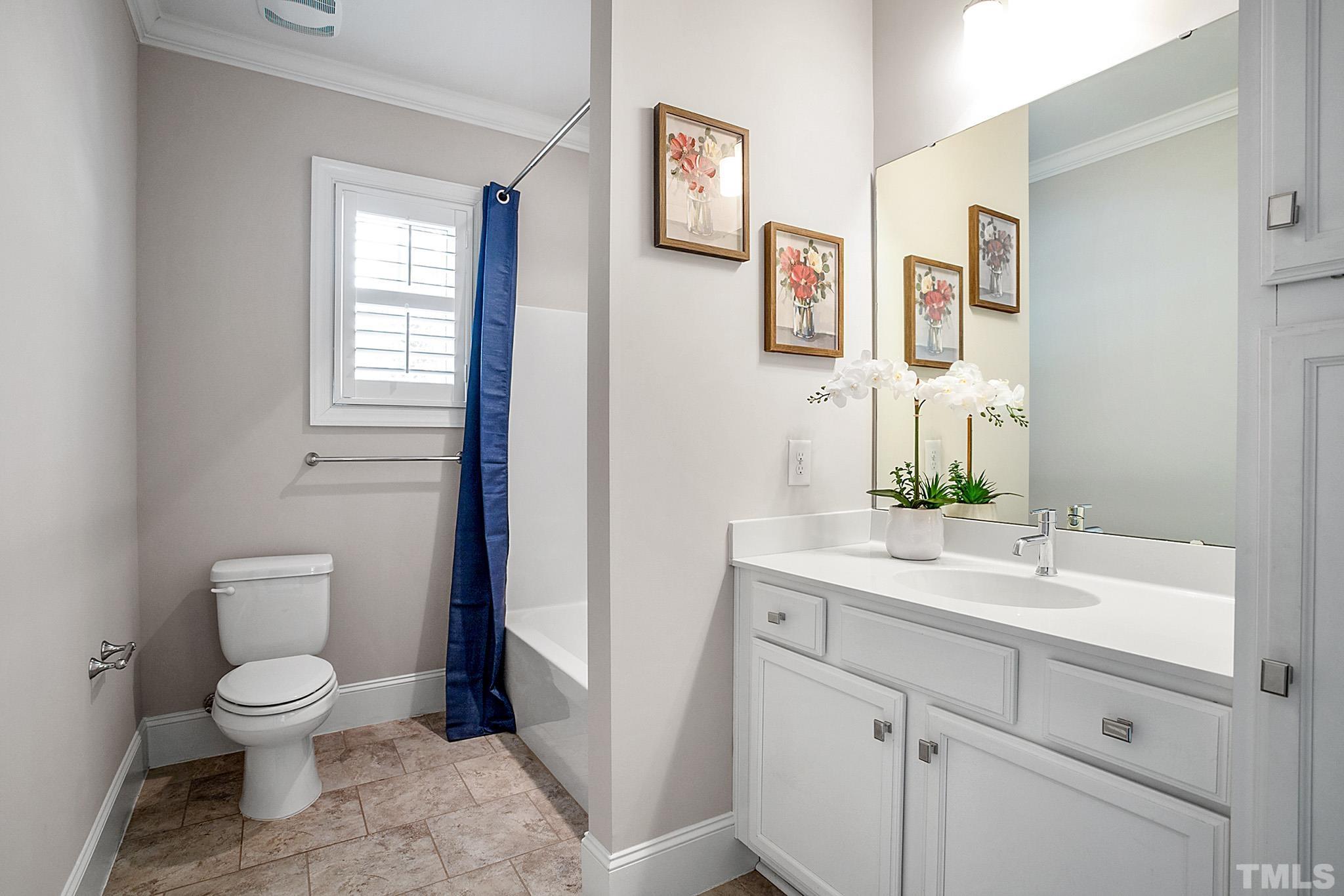 2820 Plumfield Place Raleigh, NC 27607 - Photo 18 of 23 a bathroom with a toilet sink and mirror
