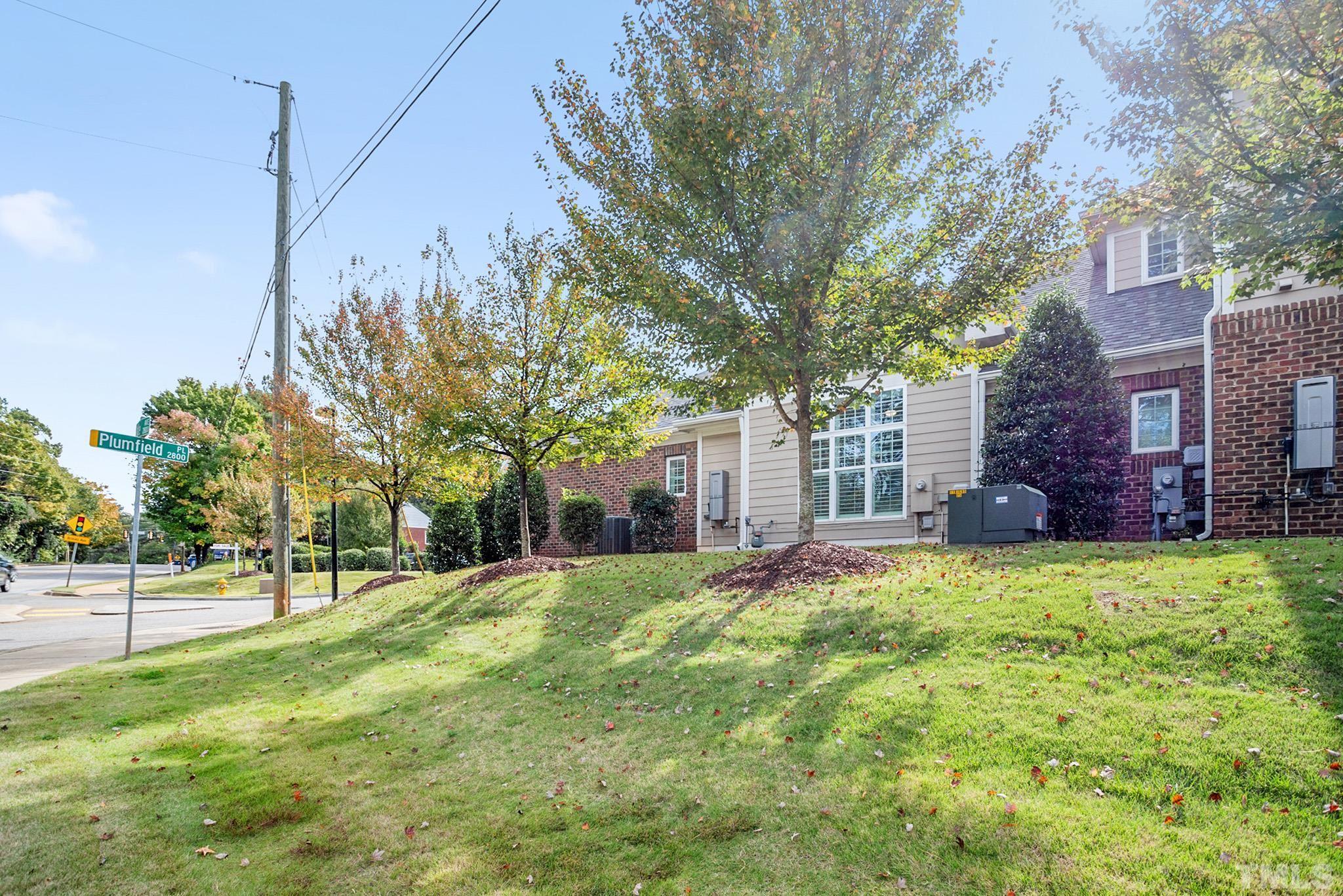 2820 Plumfield Place Raleigh, NC 27607 - Photo 23 of 23 a view of a house with a big yard and large tree