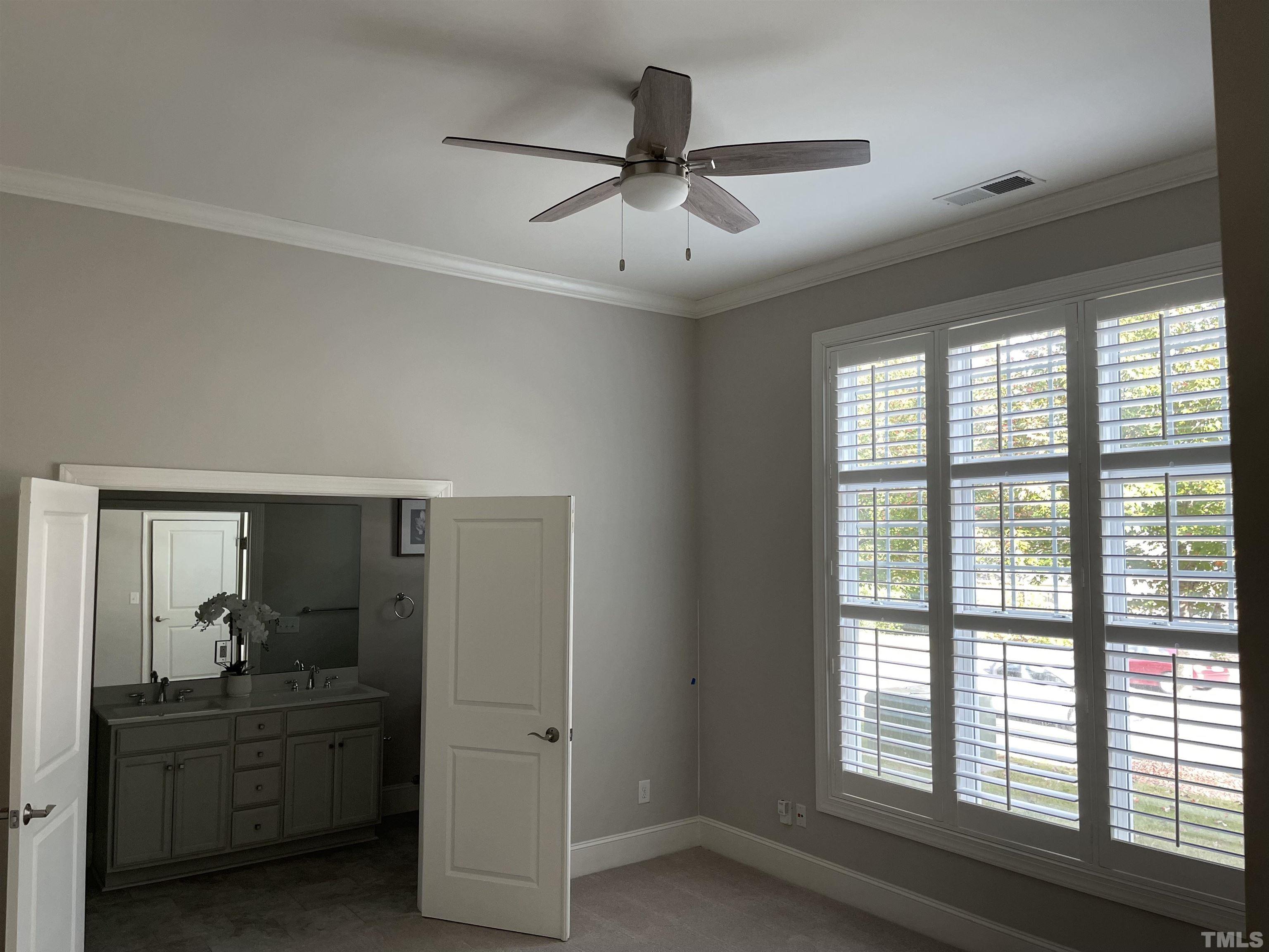 2820 Plumfield Place Raleigh, NC 27607 - Photo 7 of 23 a view of a livingroom with a ceiling fan and window
