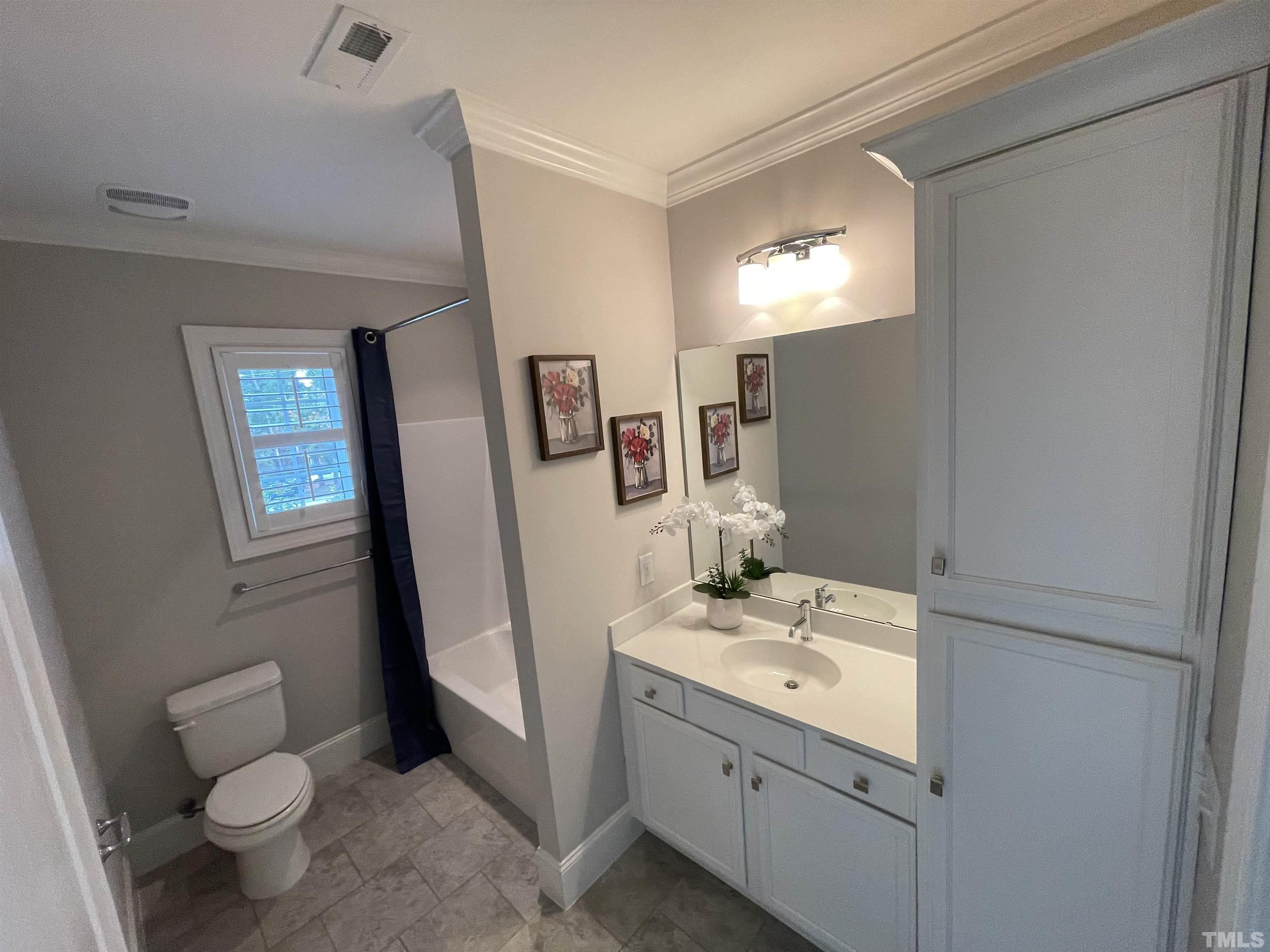2820 Plumfield Place Raleigh, NC 27607 - Photo 10 of 23 a bathroom with a sink toilet and mirror
