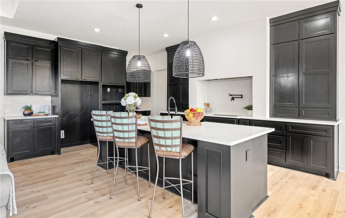 1517 Fenner Ranch Corpus Christi, TX 78415 - Photo 11 of 34 a kitchen with a table chairs sink and cabinets