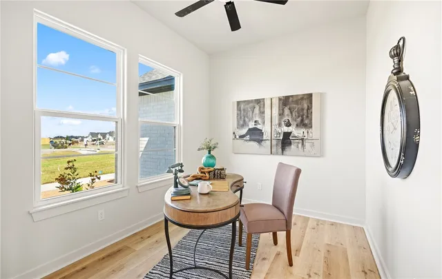 a dining room with furniture and window