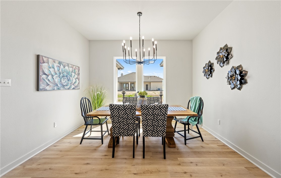 1517 Fenner Ranch Corpus Christi, TX 78415 - Photo 14 of 34 a view of a dining room with furniture window and wooden floor