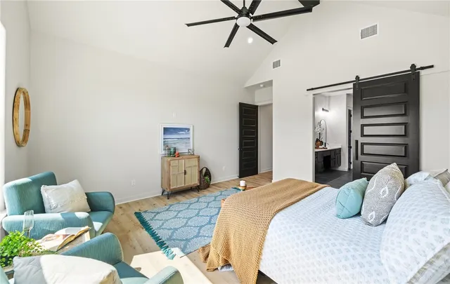 a bedroom with a bed and furniture