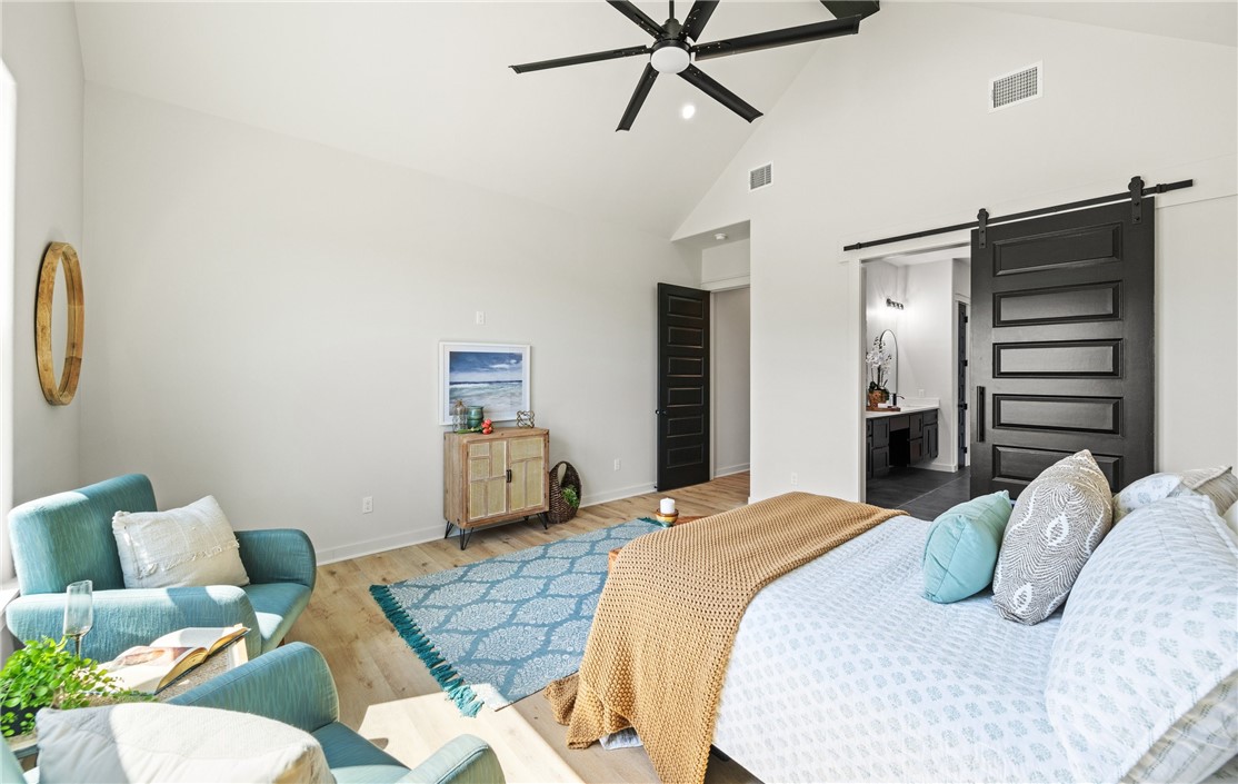 1517 Fenner Ranch Corpus Christi, TX 78415 - Photo 16 of 34 a bedroom with a bed and furniture