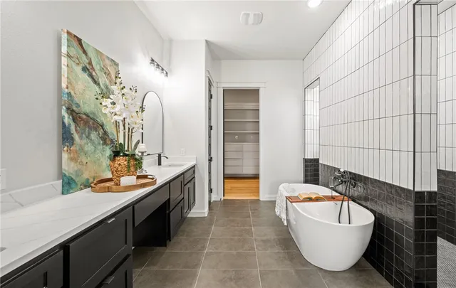 a bathroom with a bathtub sink and toilet