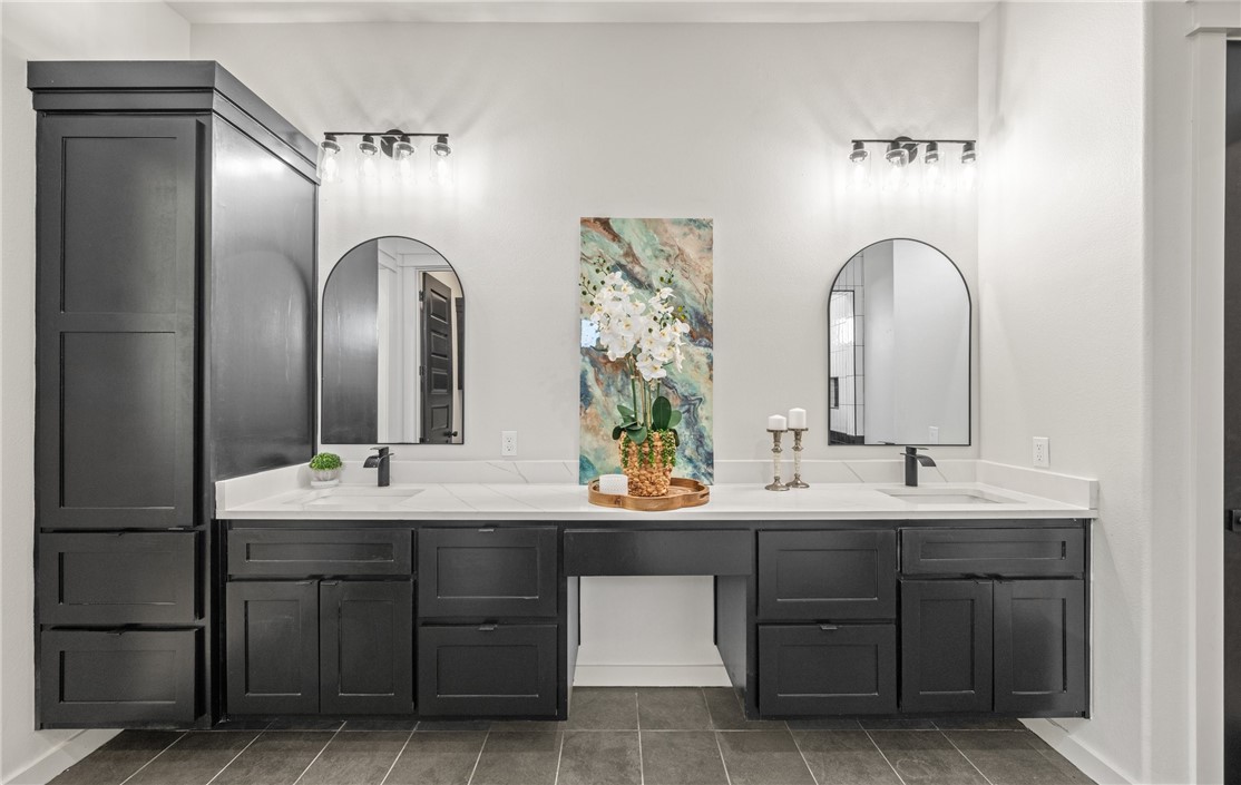 1517 Fenner Ranch Corpus Christi, TX 78415 - Photo 18 of 34 a bathroom with a double vanity sink and a mirror