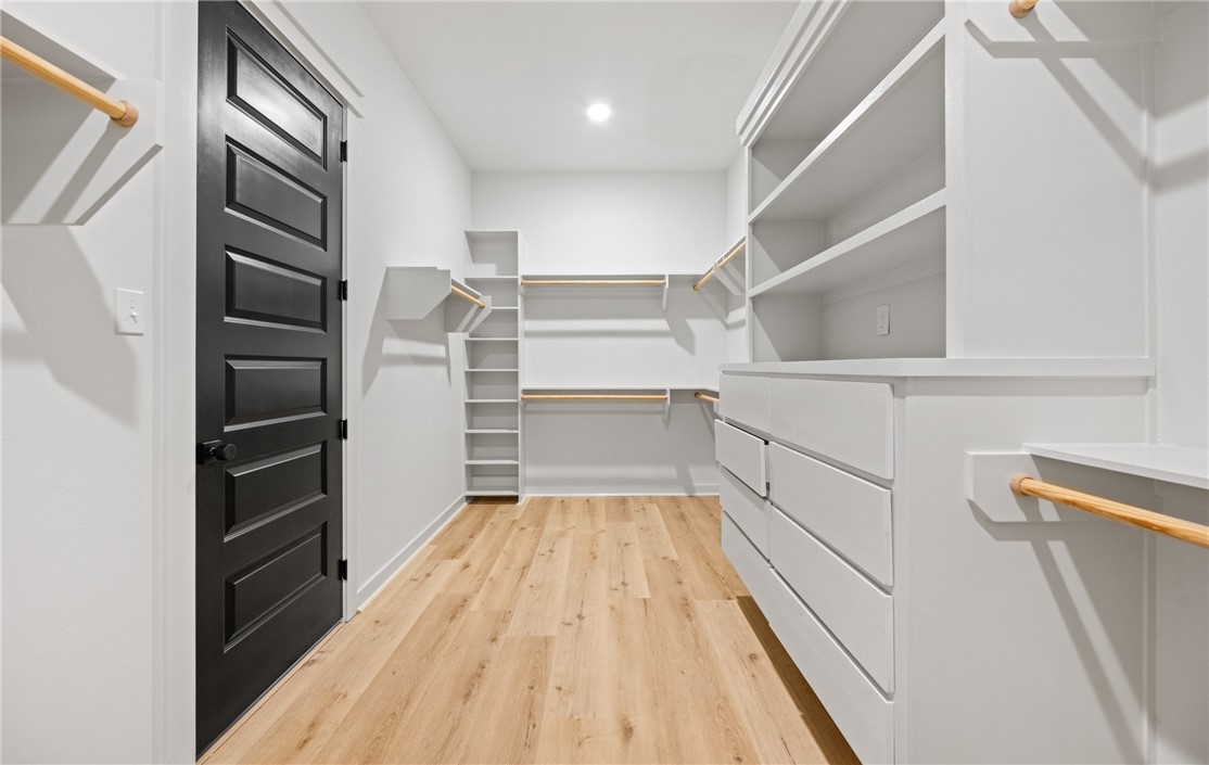 1517 Fenner Ranch Corpus Christi, TX 78415 - Photo 21 of 34 a view of walk in closet with empty racks