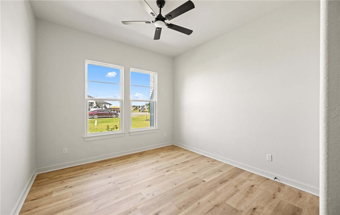 1517 Fenner Ranch Corpus Christi, TX 78415 - Photo 23 of 34 an empty room with a window and a ceiling fan
