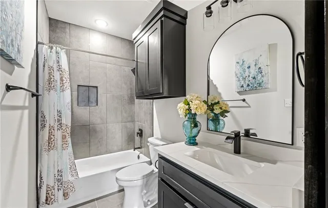 a bathroom with a sink a toilet and a bathtub