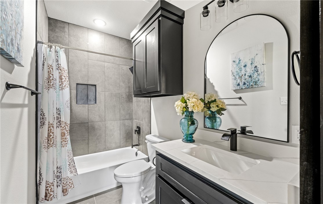 1517 Fenner Ranch Corpus Christi, TX 78415 - Photo 24 of 34 a bathroom with a sink a toilet and a bathtub