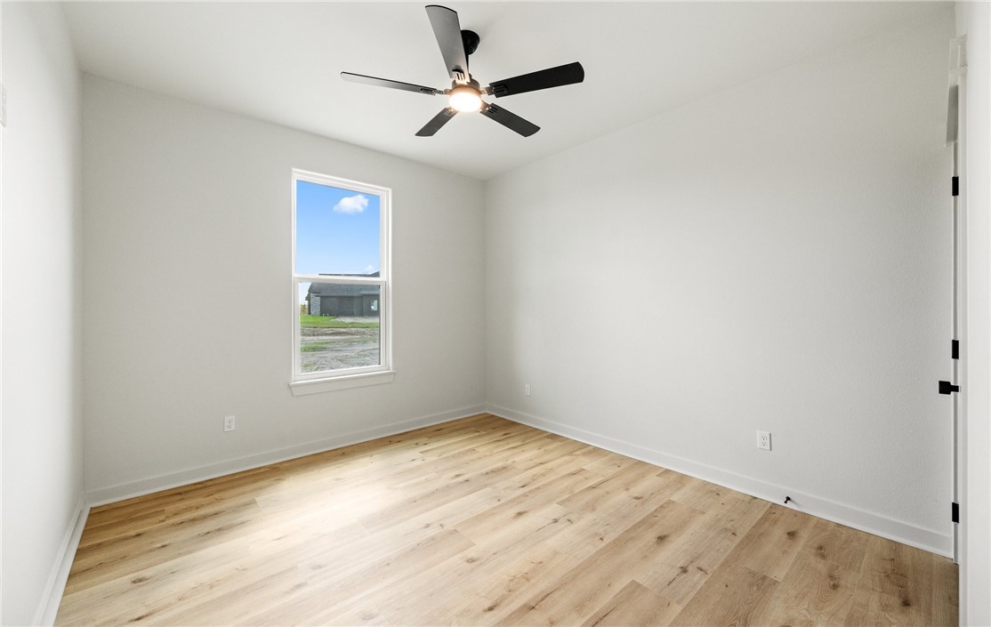 1517 Fenner Ranch Corpus Christi, TX 78415 - Photo 27 of 34 an empty room with a window and a fan