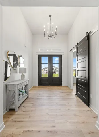 a view of a kitchen with a stove cabinets and wooden floor