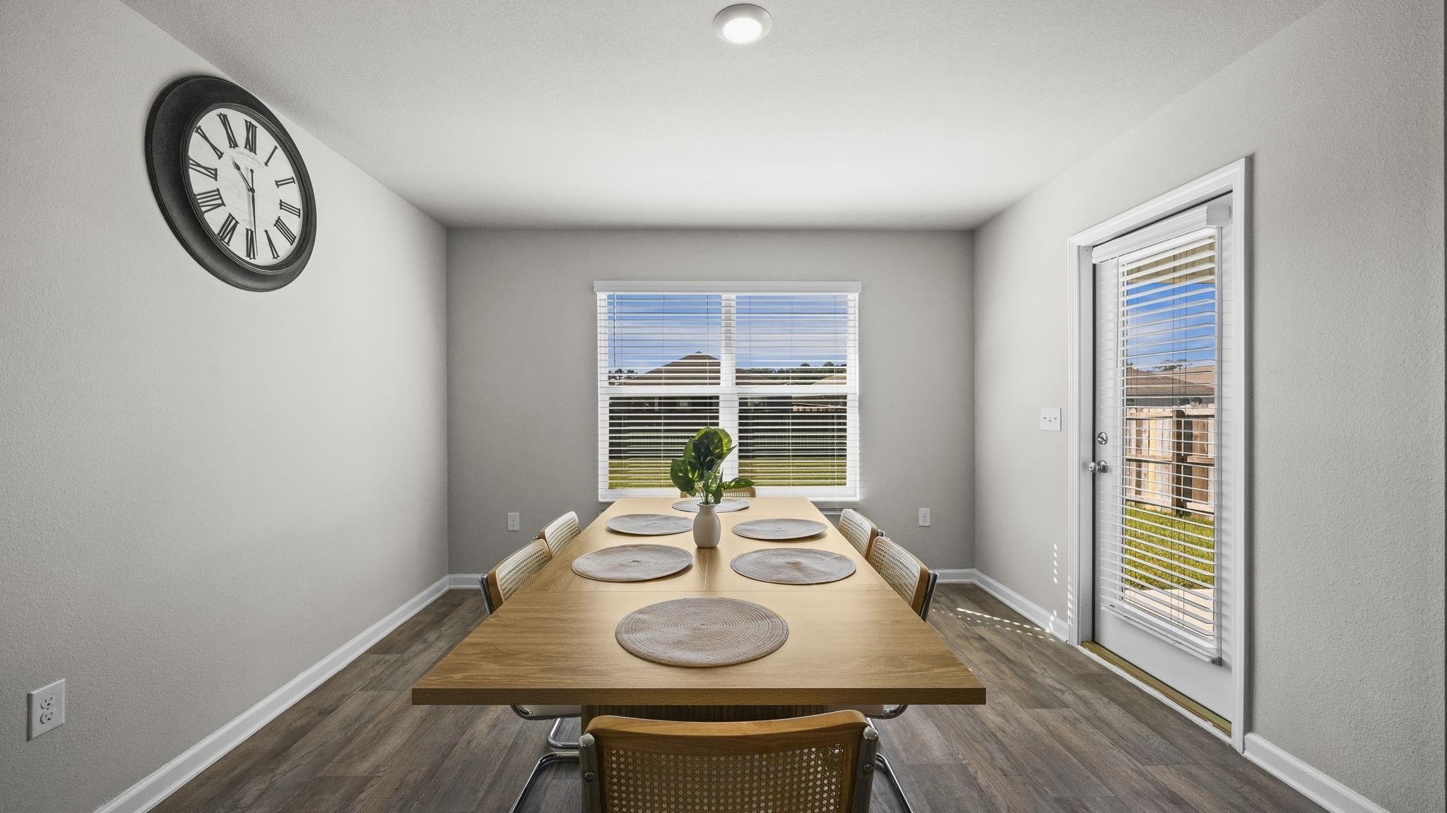224 Burnston Way Foley, AL 36535 - Photo 9 of 42 Dining room with healthy amount of natural light and dark wood-style floors