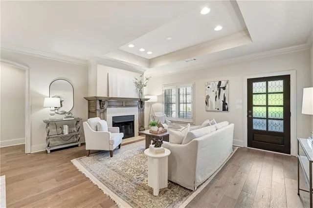 a living room with furniture a rug and a fireplace