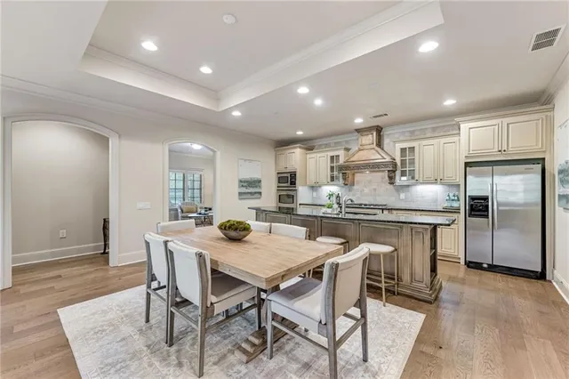 a kitchen with a table and chairs in it