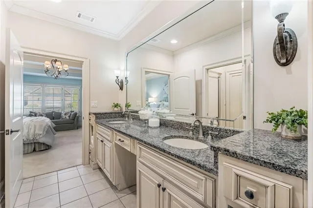 a spacious bathroom with a granite countertop sink and a mirror
