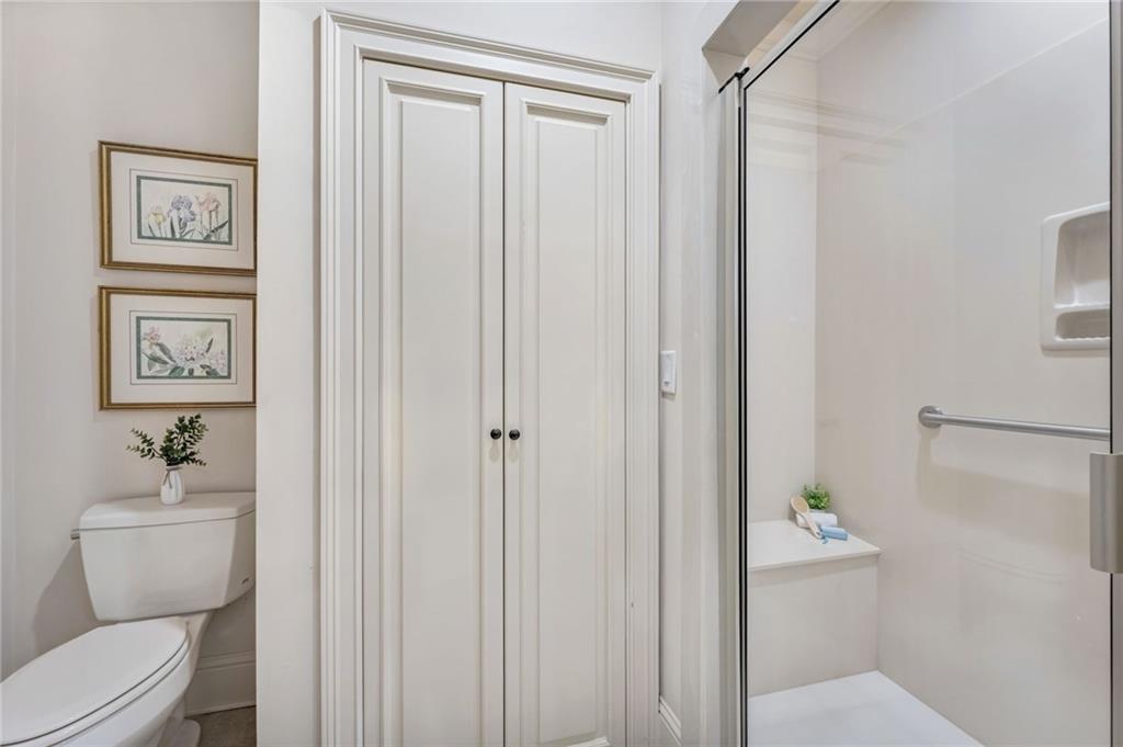 2550 Ballantrae Circle, Unit 53F Cumming, GA 30041 - Photo 21 of 46 a bathroom with a toilet and a shower