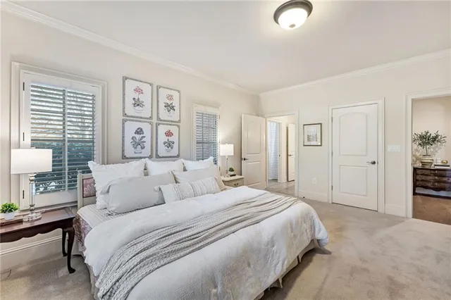a en suite bathroom with a granite countertop sink and a mirror