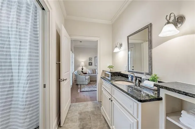 a bathroom with a double vanity sink and a mirror