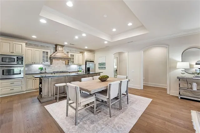 a kitchen with a table and chairs in it