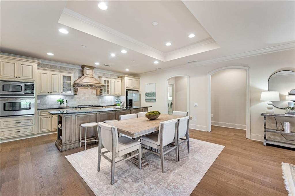 2550 Ballantrae Circle, Unit 53F Cumming, GA 30041 - Photo 3 of 46 a kitchen with a table and chairs in it