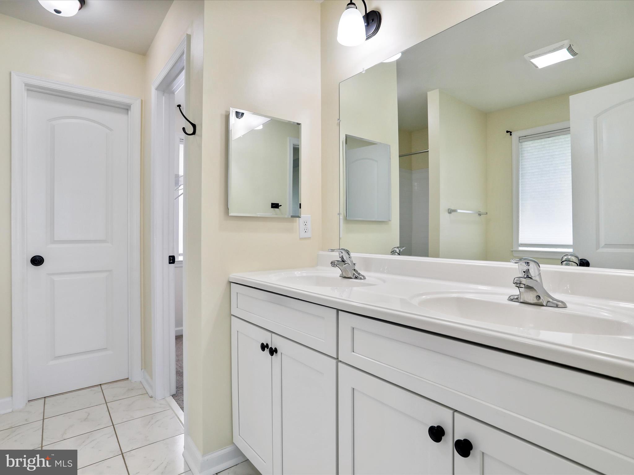 1613 Needy Road Martinsburg, WV 25405 - Photo 13 of 37 a bathroom with a sink double vanity and a mirror