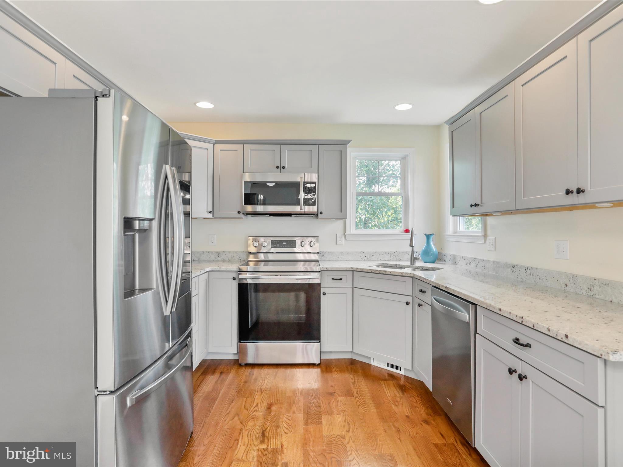 1613 Needy Road Martinsburg, WV 25405 - Photo 2 of 37 a kitchen with stainless steel appliances granite countertop a refrigerator sink and stove