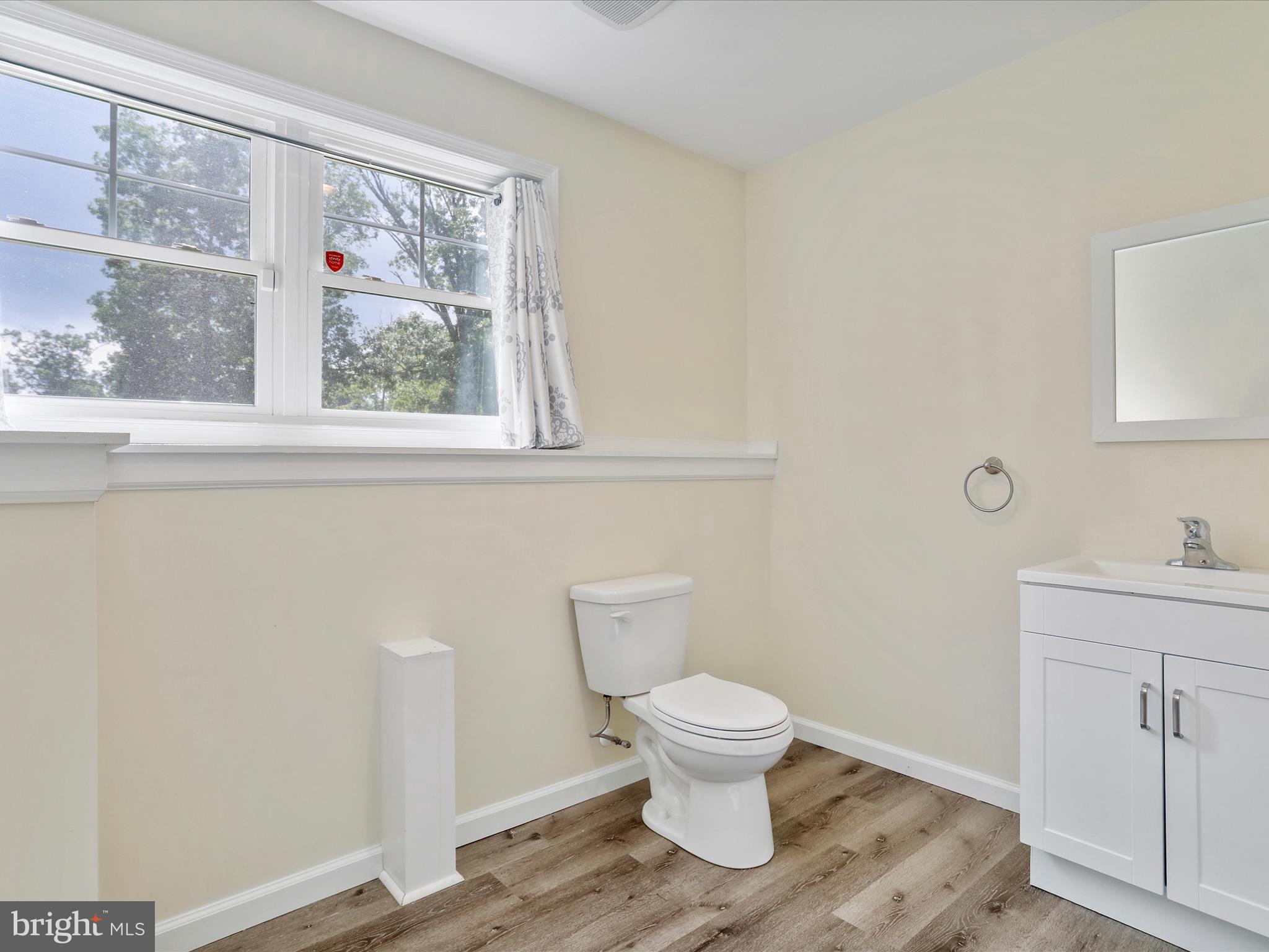1613 Needy Road Martinsburg, WV 25405 - Photo 26 of 37 a white toilet sitting next to a bathroom sink