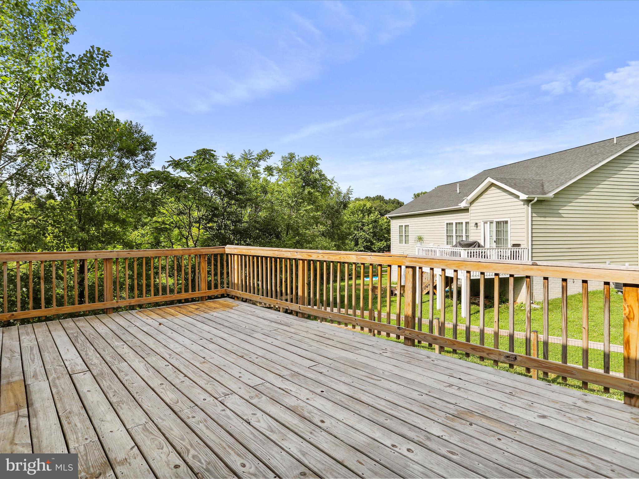 1613 Needy Road Martinsburg, WV 25405 - Photo 33 of 37 a view of a wooden deck with a yard