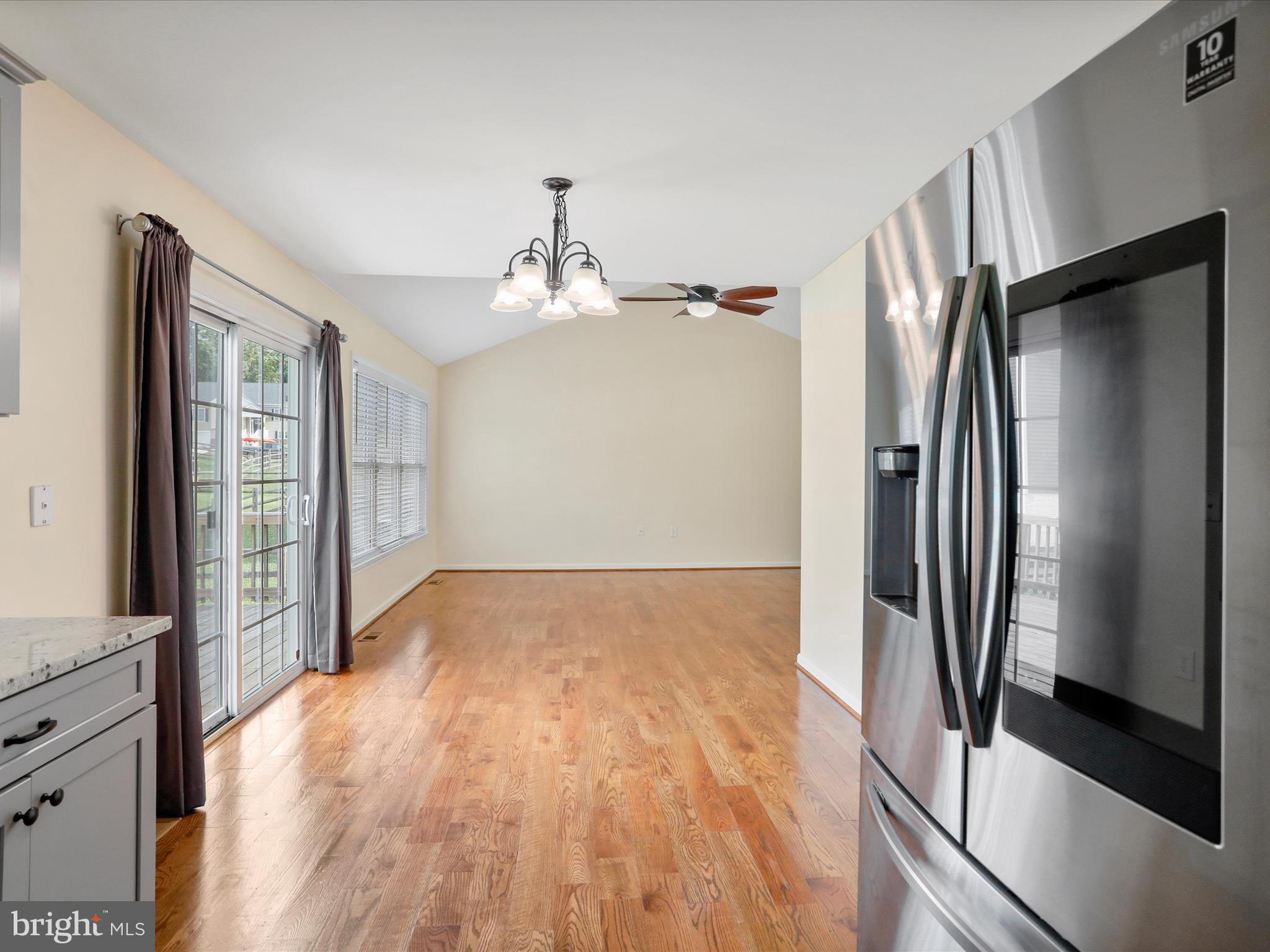 1613 Needy Road Martinsburg, WV 25405 - Photo 6 of 37 a view of a refrigerator in kitchen and an empty room