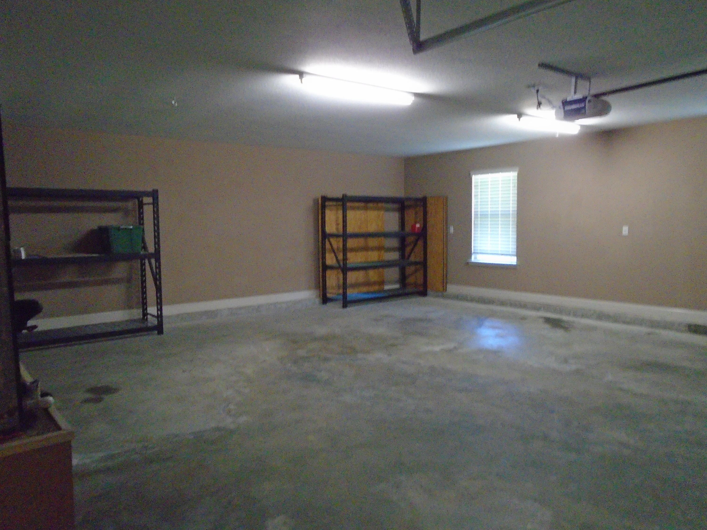 672 Red Fern Road Crestview, FL 32536 - Photo 24 of 27 an empty room with windows and cabinet