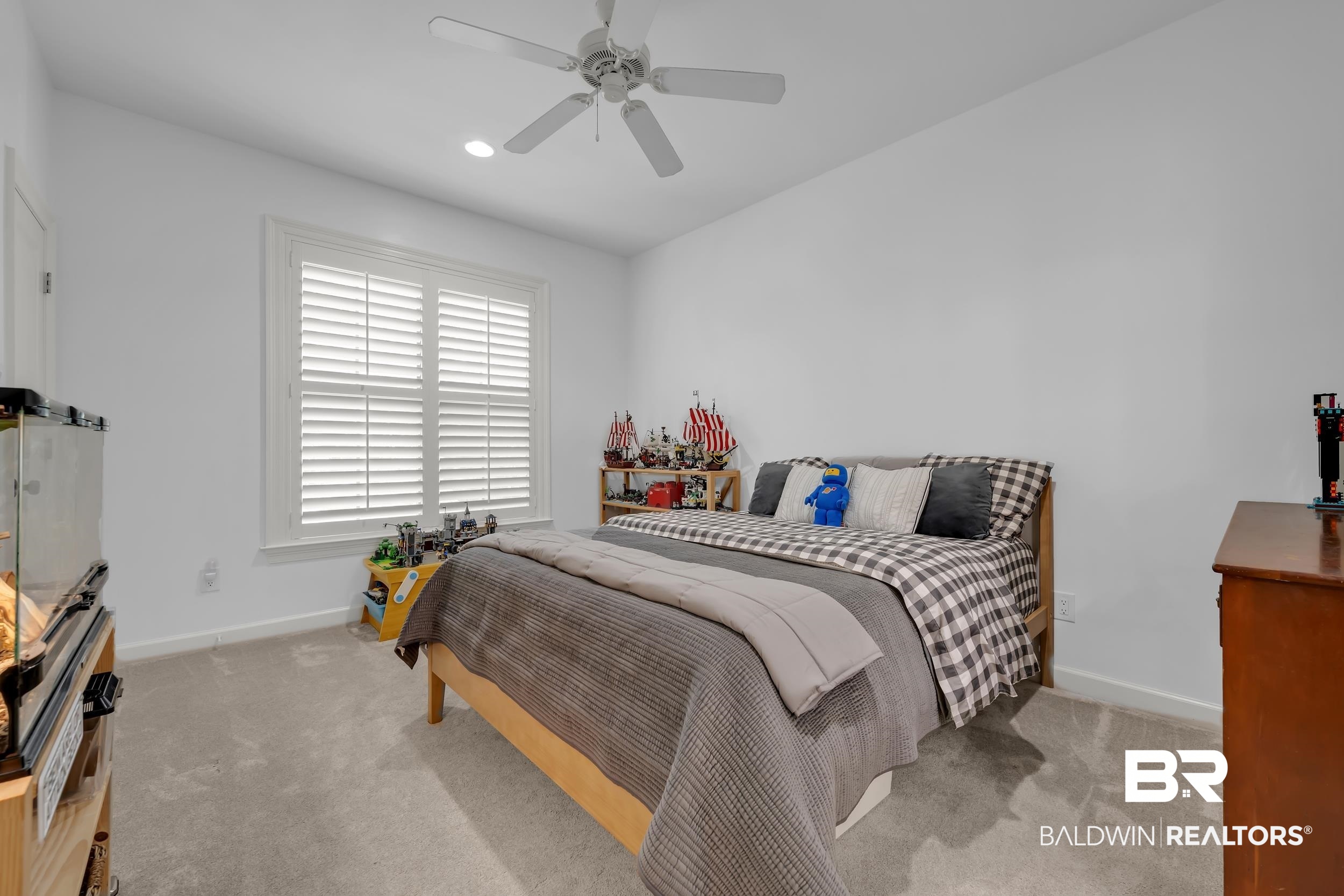 8137 Pine Run Daphne, AL 36527 - Photo 29 of 67 Carpeted bedroom featuring a ceiling fan with integrated lighting, recessed lighting, and a window with plantation shutters