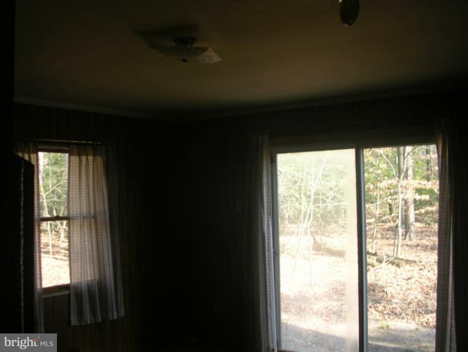 7450 Todds Wharf Road Preston, MD 21655 - Photo 3 of 7 a view of an empty room and window