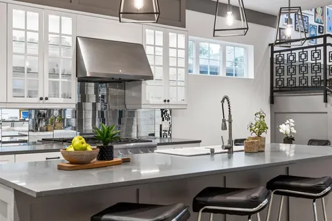 a kitchen with a sink cabinets and window