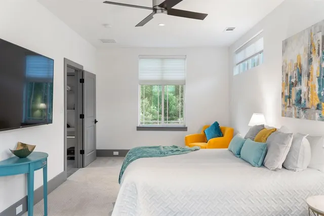 a bedroom with a bed and window