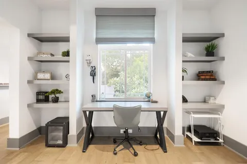 a workspace with furniture and a window
