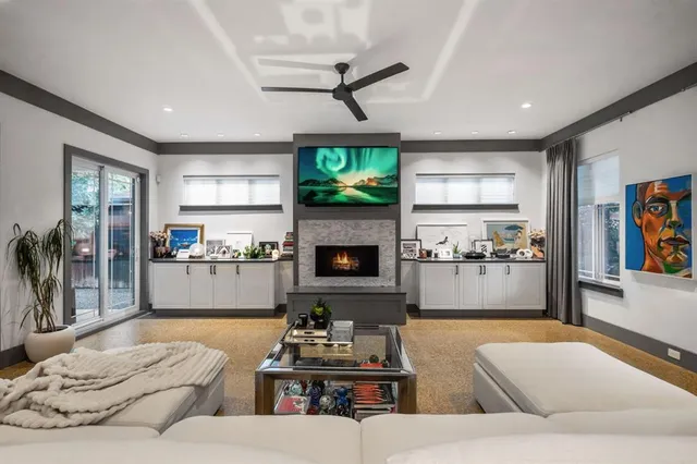 a living room with furniture and a fireplace